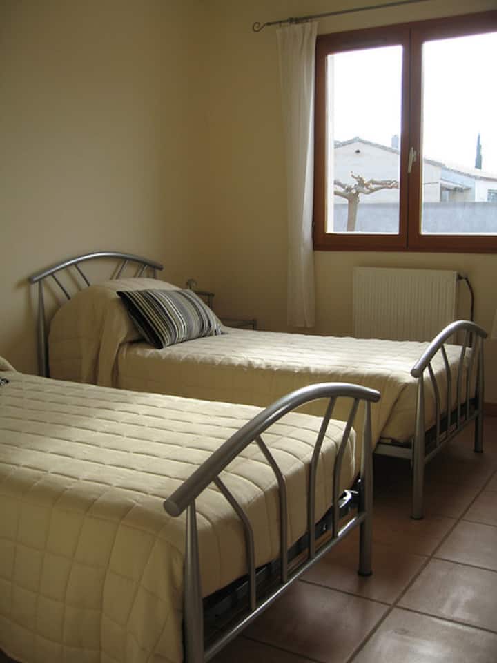 The spacious twin bedroom with two single beds