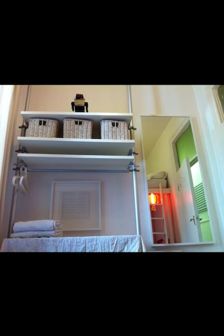 Smaller Bedroom. With work desk to use or to hang up cloth. Loft bed in the mirrow.