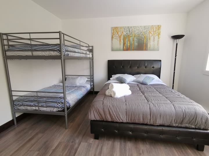 Bedroom 2 offers a snug Queen sized bed and a bunk bed