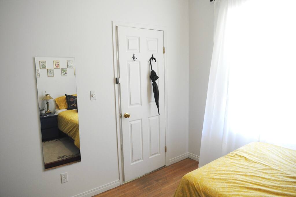 A full length mirror so you can check yourself out before you head out. Hooks on the door for your coat or bag and an umbrella to use if you need. We added a door lock for extra security and privacy but that being said, we will never enter your room without permission.
