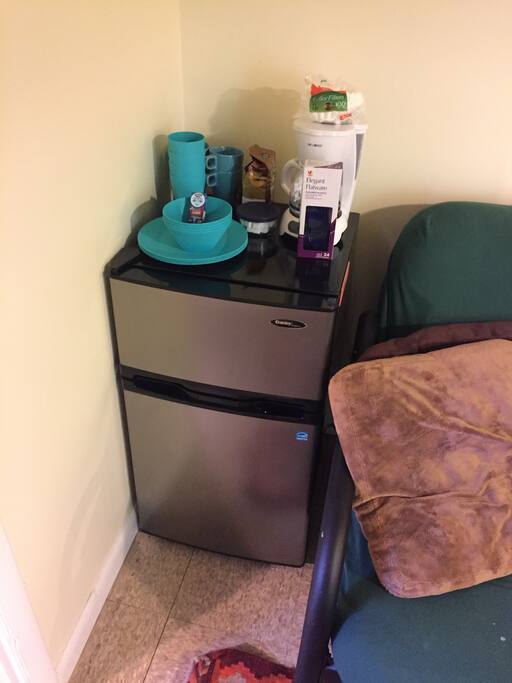 Mini fridge and freezer, dishes, coffee machine, and complimentary Good Day Chocolates!