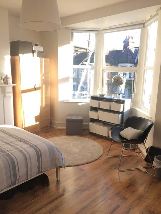 Warm and bright with south facing views of the quiet road.
