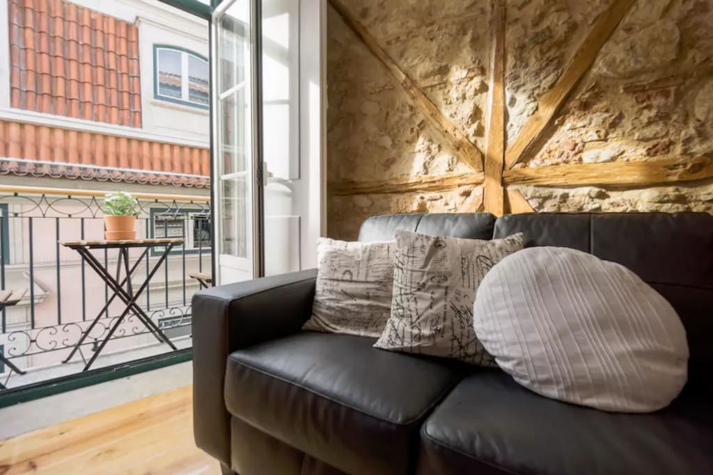 cozy living room with balcony and historic building features