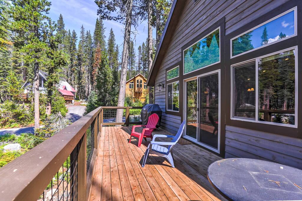Spend evenings relaxing on the expansive porch with views of the lush forest.