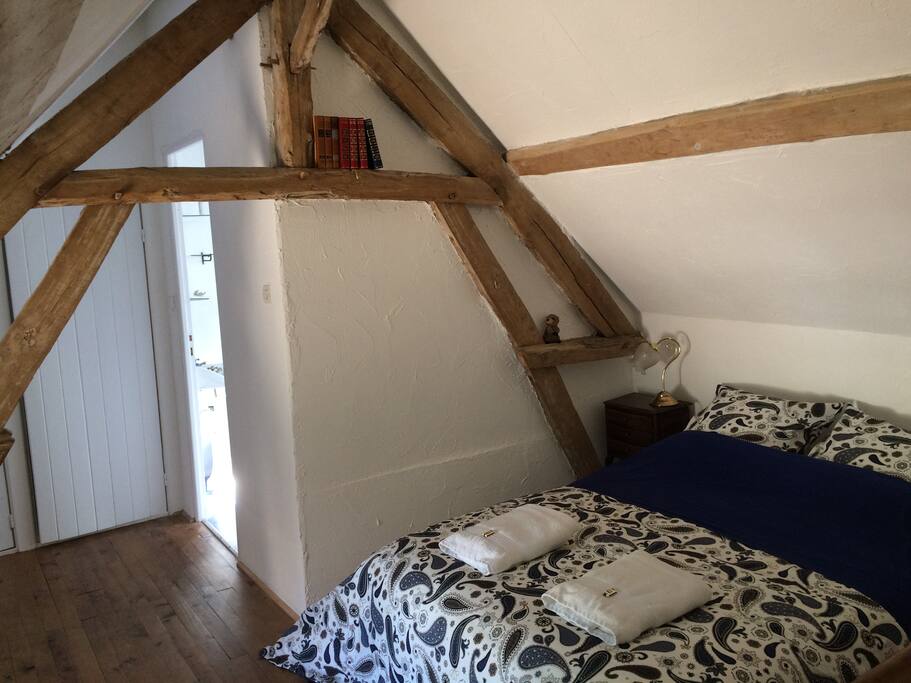 Loft bedroom with comfortable double bed