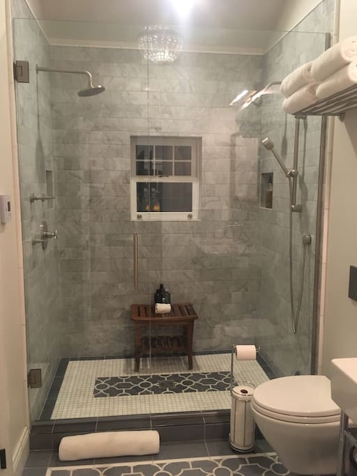 Main level bathroom with heated marble floors.