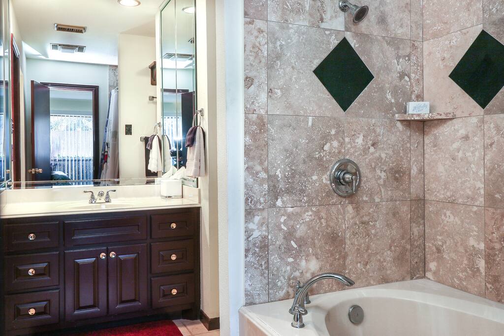 Relax in your own large luxury tiled jacuzzi tub & shower