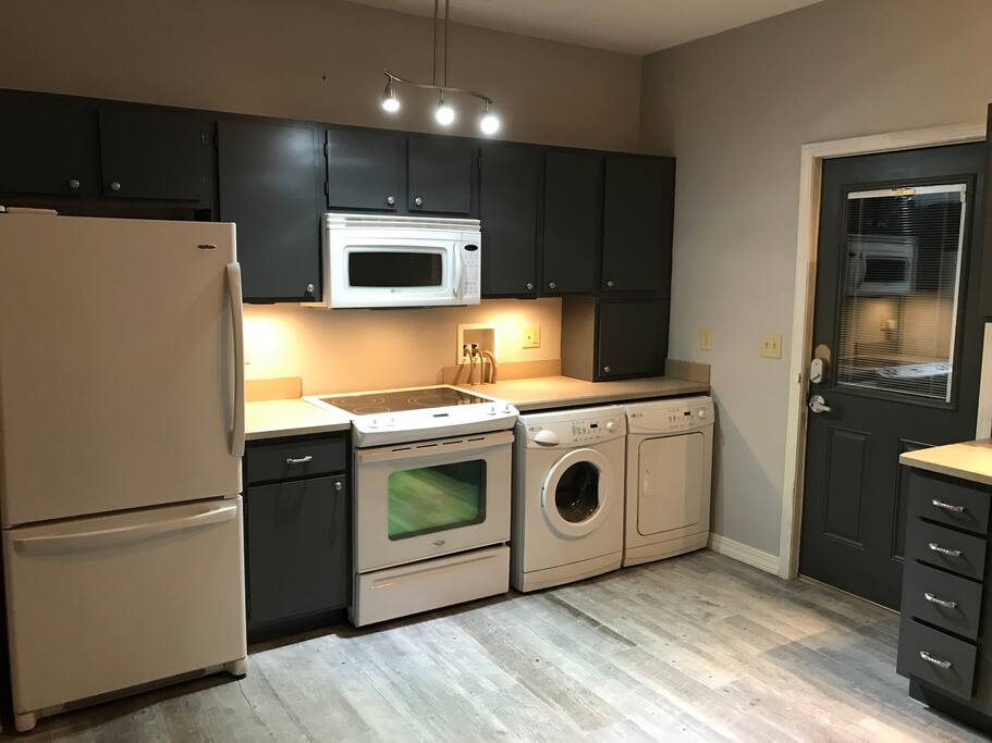 Kitchen - new floors and paint - showing backdoor access