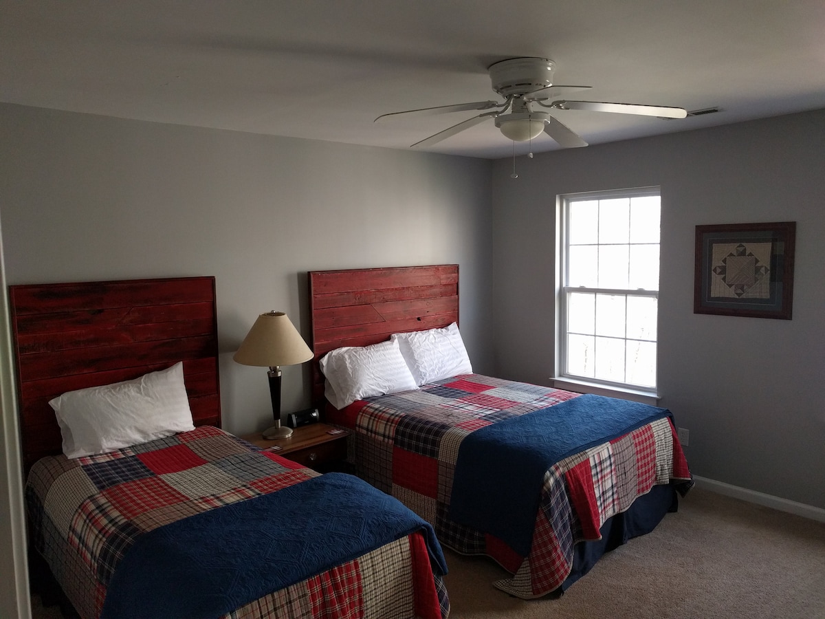 Red room with a full and twin bed, we made the headboards.