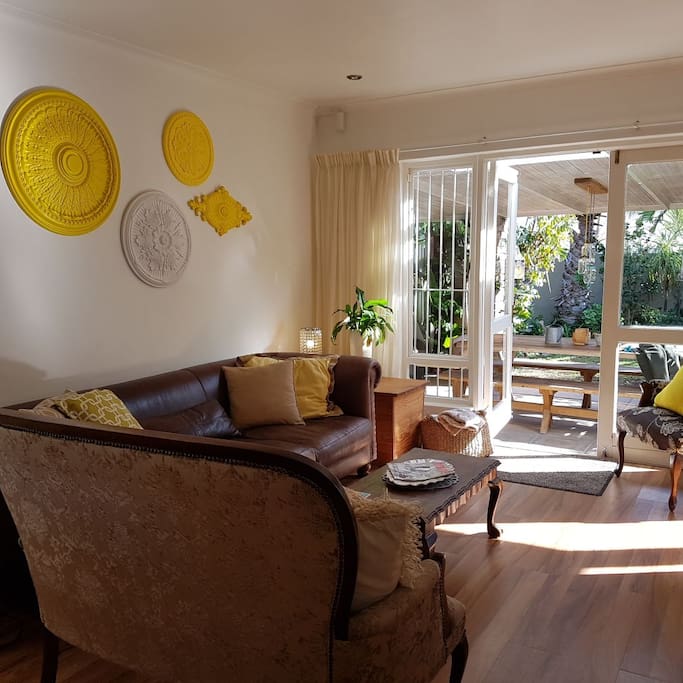 Lounge to double patio doors with outside dining