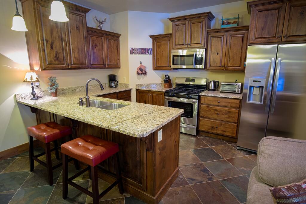 Beautiful kitchen area and seating for two at the bar.