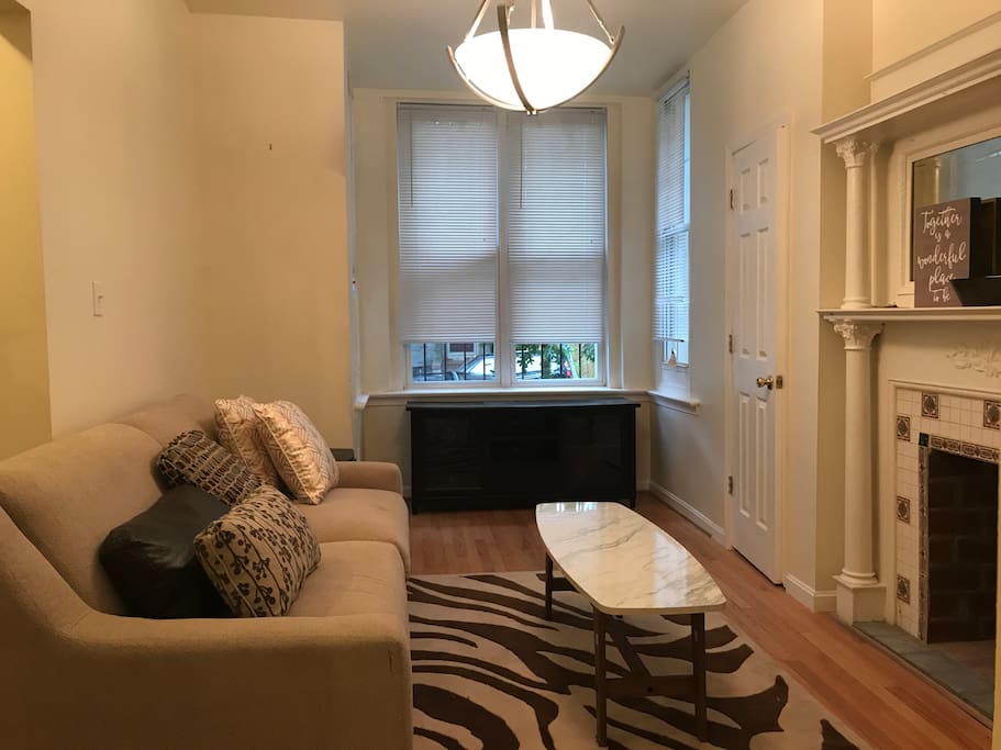 Living room with fireplace and sofa bed #1.