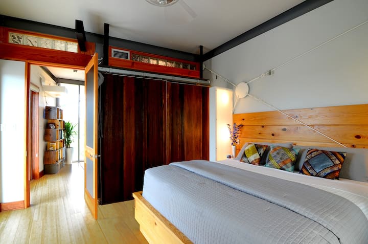 3rd Floor | Private bedroom w/ reclaimed sliding barn doors to reveal closet