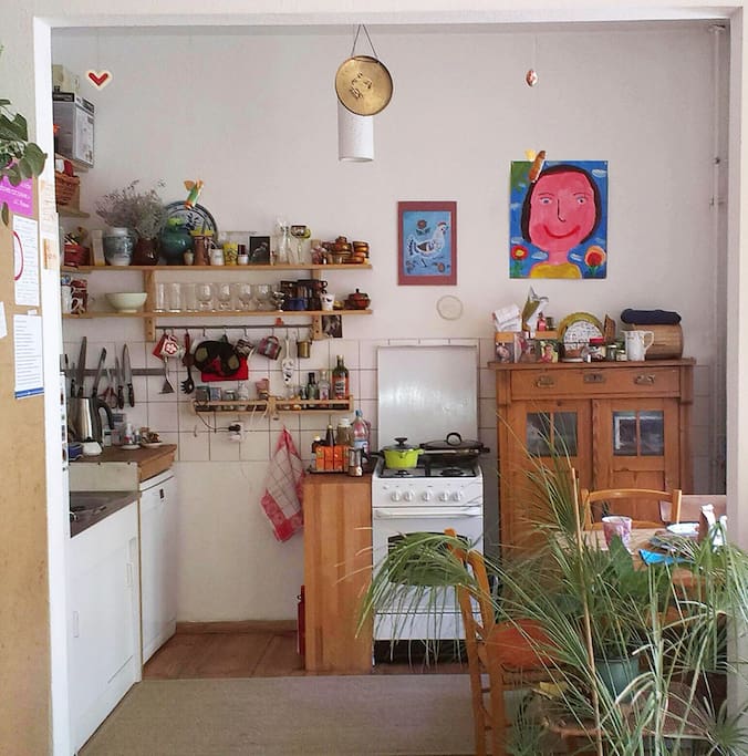 Small kitchen with antique furniture and kitchen appliances from
today
(Dishwasher, fridge, kettle and Italian espresso maker)