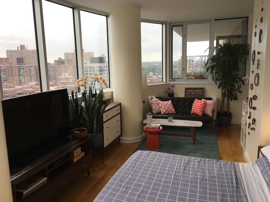 Seating area, behind that is your personal balcony. If you can't sleep there is a 55 inch curve TV so you can catch up on your favorite shows.