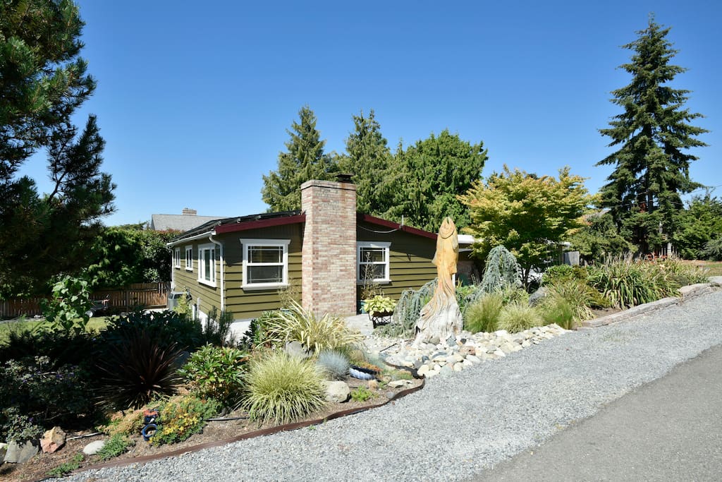 Again, you can see our beautiful solar installation (I'm still nerding out about it). To the right you can see our 7' tall salmon statue in the dry river bed. The salmon statue is carved into a fixed stump and is apparently a "Pokemon Gym"