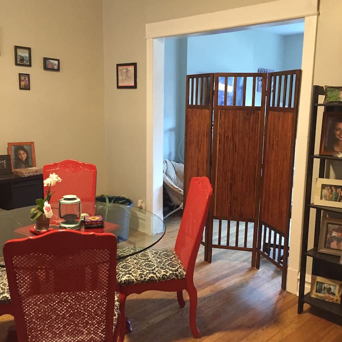 The living room is set off from the rest of the apartment. It is located behind the privacy screen.