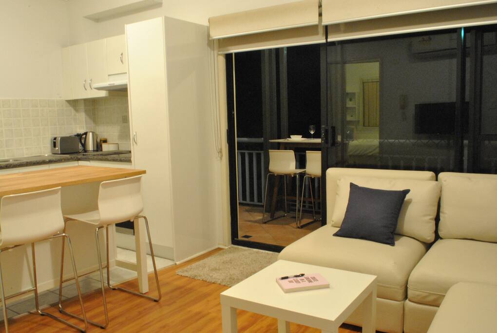 Open plan lounge room and kitchen.