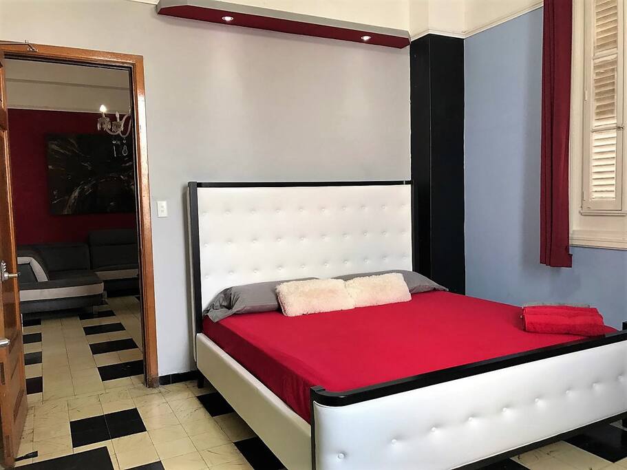 Bedroom with king size bed and comfortable mattress, from the windows a spectacular view of the city and the sea.