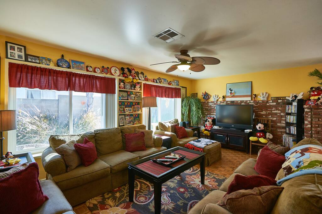 Living room with lots of comfortable seating and big screen tv