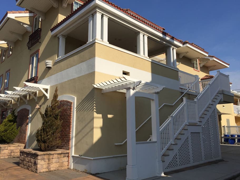 Entrance to condo, 2 car parking under stairs