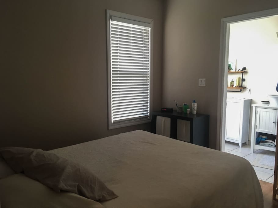 Bedroom with queen bed and closet space