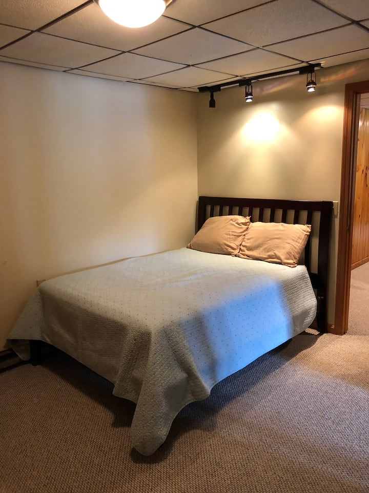 Queen bed, downstairs.