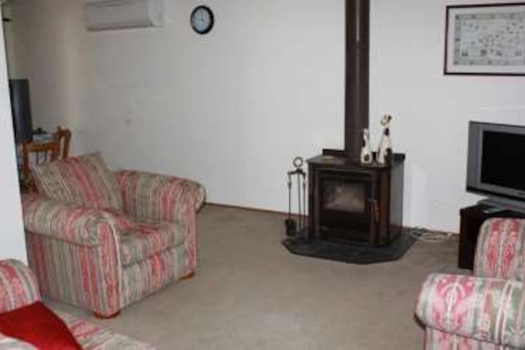 Wood fire place, Flat screen TV and DVD player.