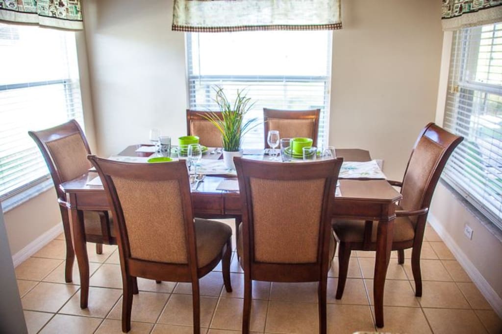 Dining area with six chairs with wide double sides windows