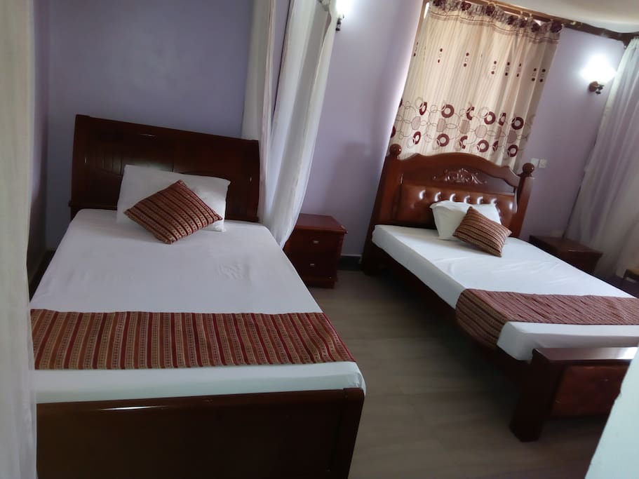 Twin room.
Spacious, TV,fan,hot shower,closet,balcony, working table,mosquito net, access card