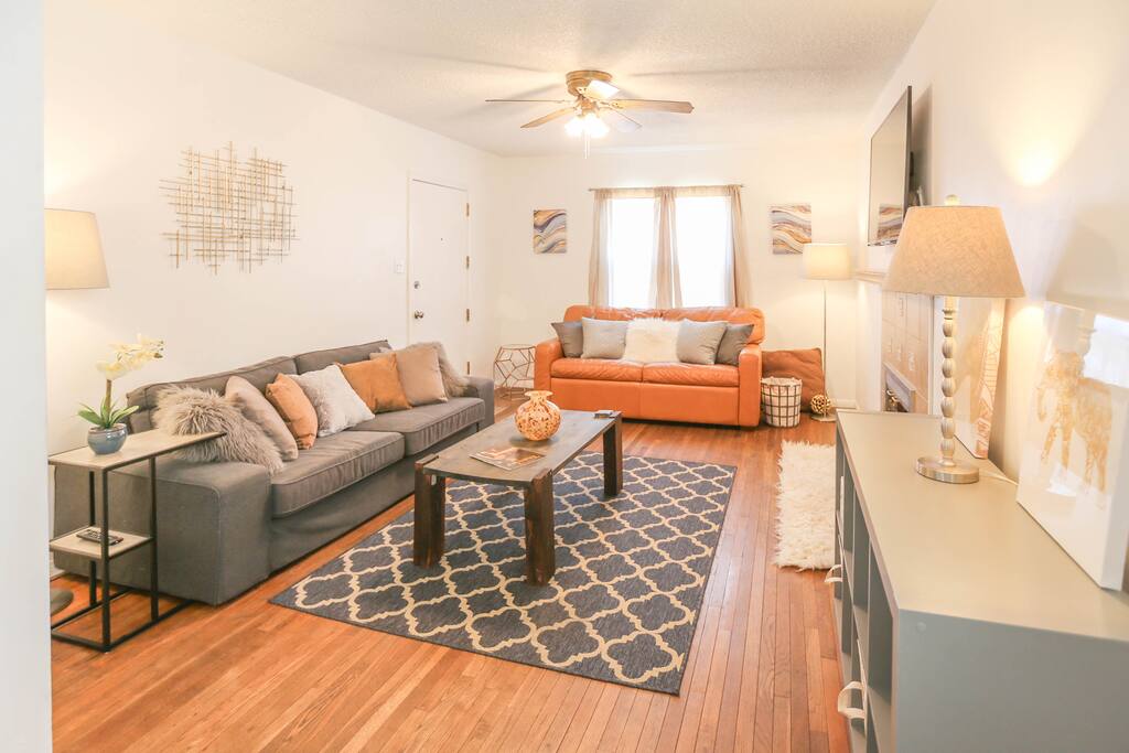 Living room great for relaxing with two couches (brown leather couch is a pullout with a very comfortable bed). HD 4K TV with Netflix & Amazon Prime