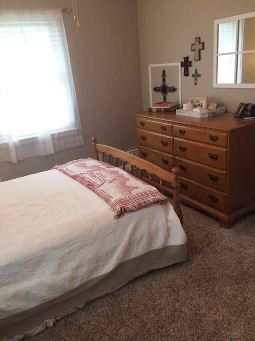Private guest bedroom with closet space and storage drawers