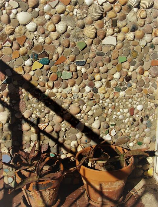 Close up on the wall decoration of the balcony . We like arts and crafts!
