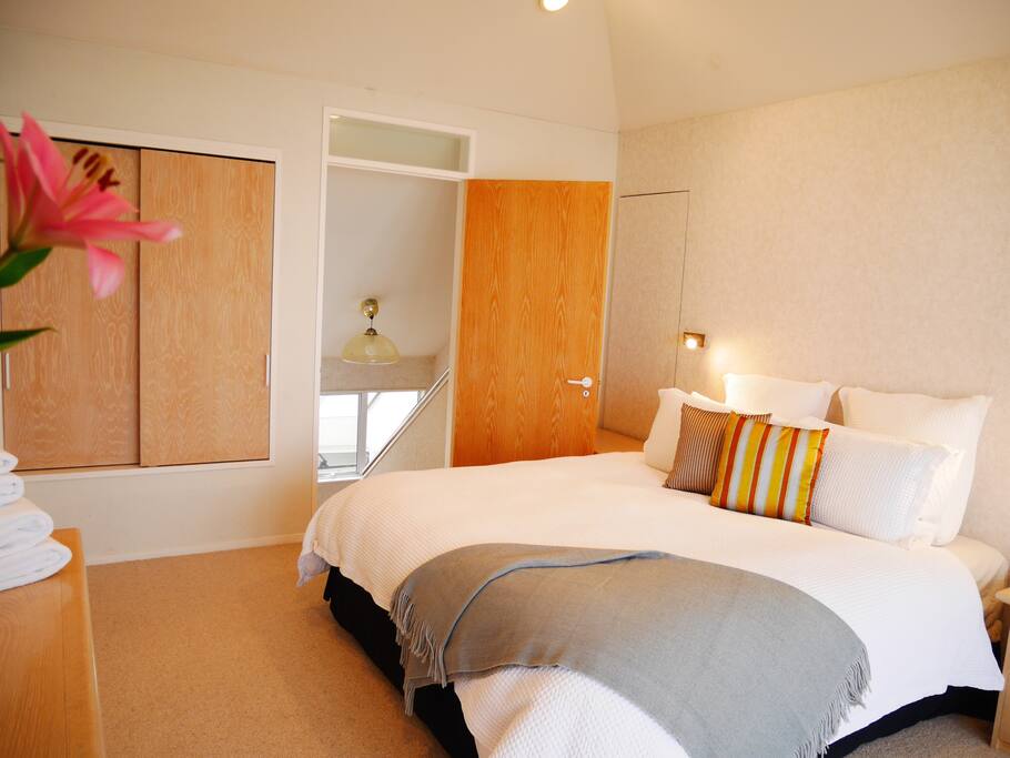Upstairs master bedroom, with private balcony and bathroom