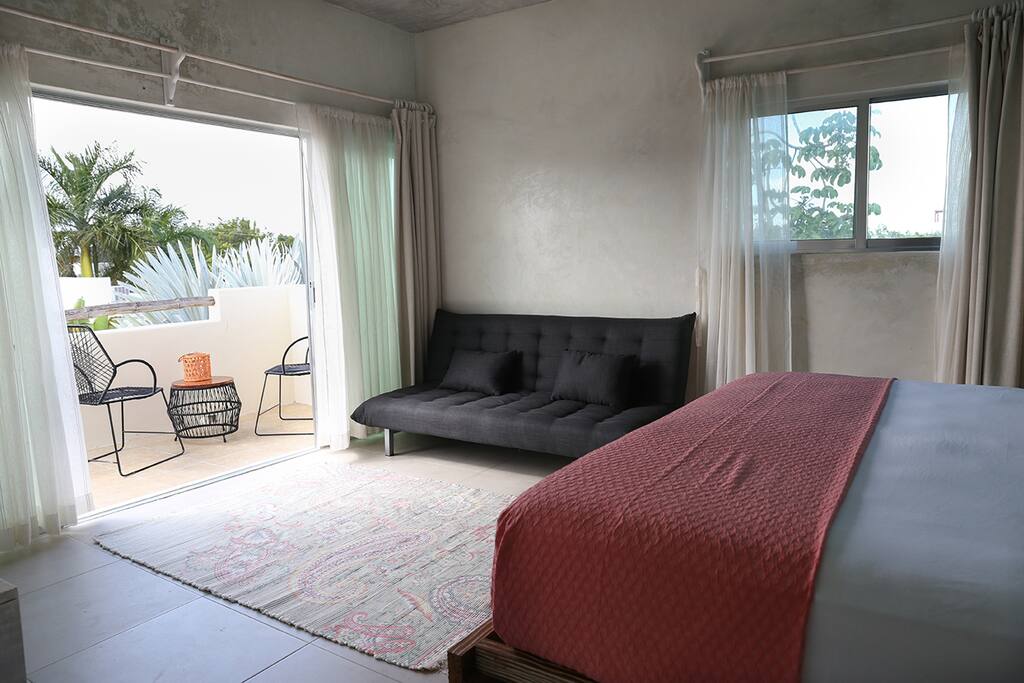 Spacious Bedroom with Futon bed and wide balcony. Black out curtains.