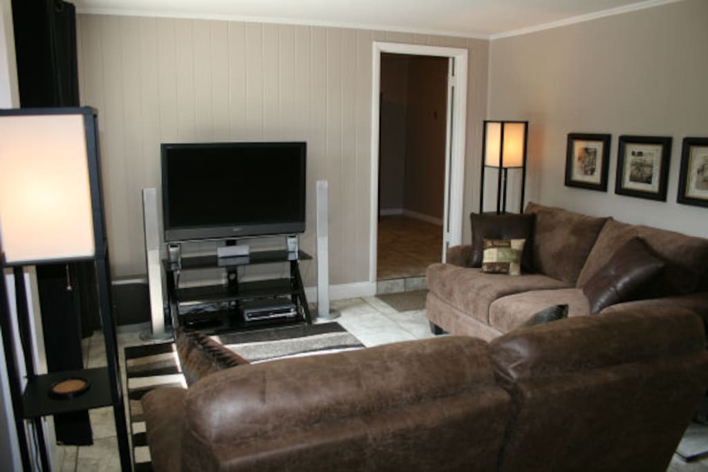 Casual gathering room with leather double recliners and oversized, overstuffed love seat!