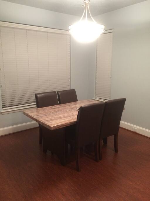 Elegant marble dining table with comfortable leather chairs