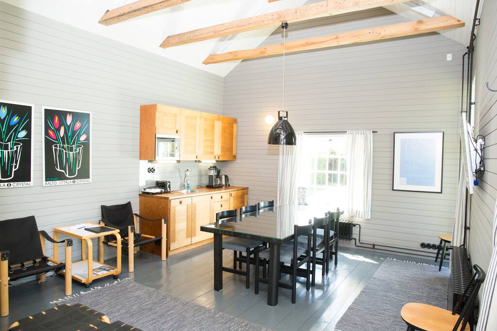 Liiteri has its own kitchen space with a small stove and fridge. Living room space decorated with Alvar Aalto's furniture.