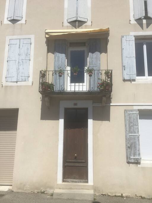 The front door to the apartments with the balcony to my pied a terre just above it.