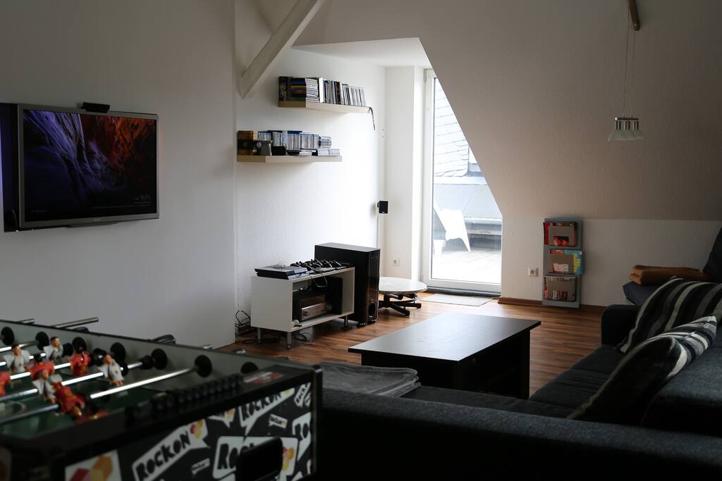Wohnzimmer mit Ausgang auf die Dachterrasse
