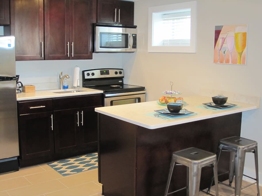 Large kitchen and breakfast bar for dining, and planning out your day