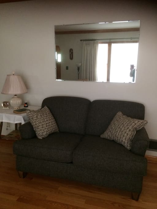 Relax in the living room-watch TV or enjoy the view from the picture window