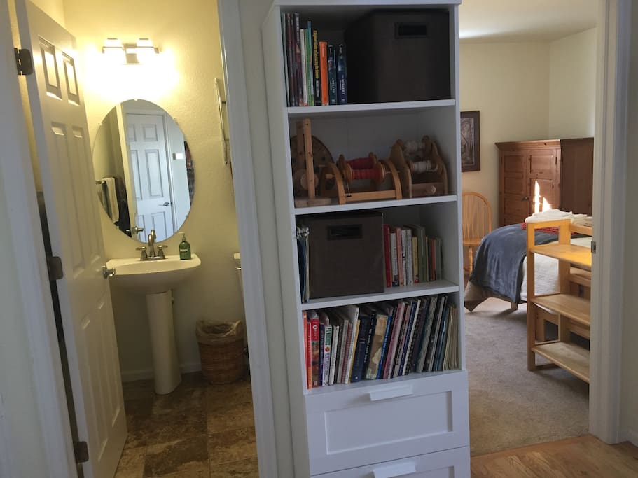 Bedroom with adjacent half bath