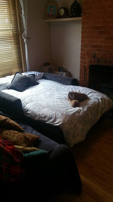 Sofa converted to a bed.