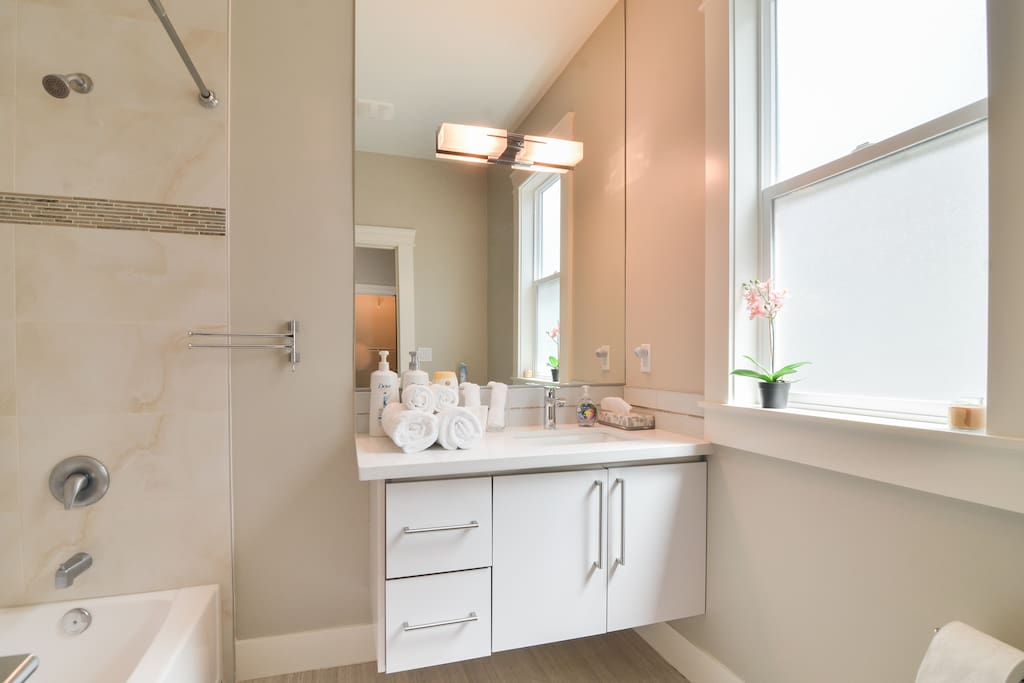 Private, en-suite bathroom with towels, shampoo, soap, and more