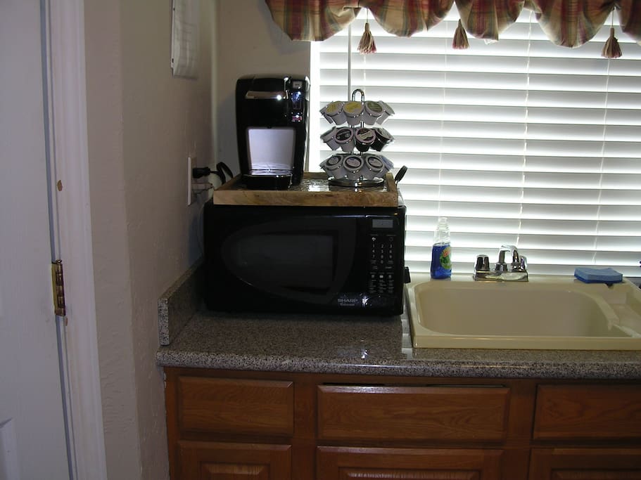 Kuerig coffee maker, microwave, deep kitchen sink