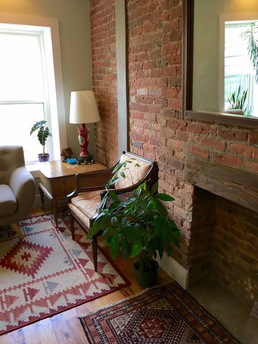 Living room overlooks quiet backyards.