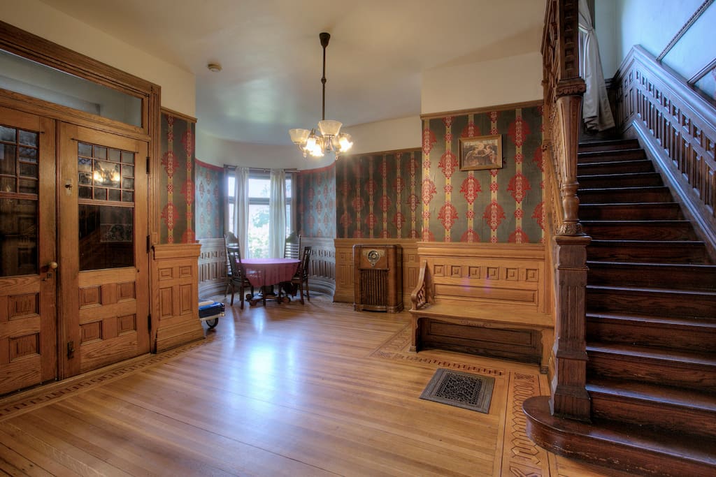 Front foyer with turret. Table seats 4-6 for extra seating for large groups.