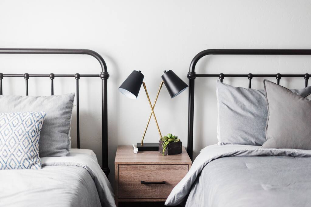 Twin bed on left, Queen on right