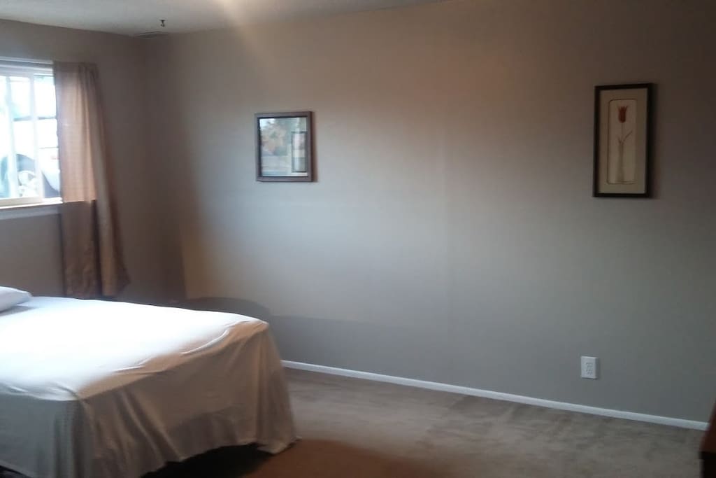 Large bedroom with ample space for seating or another smaller bed for two to share this room.
